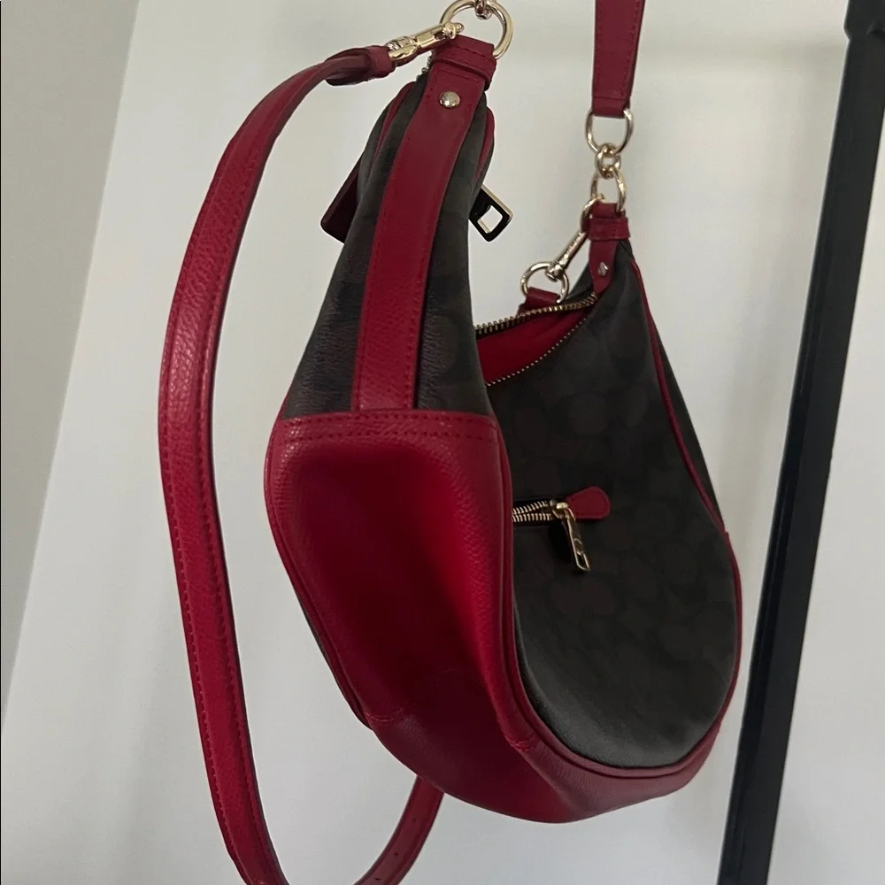Coach Harley East/West Hobo in Signature - crescent canvas with red leather trim